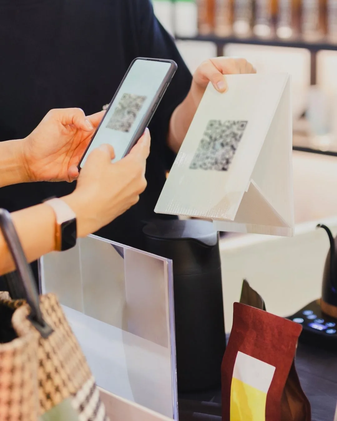 Customer scanning the QR code at the counter